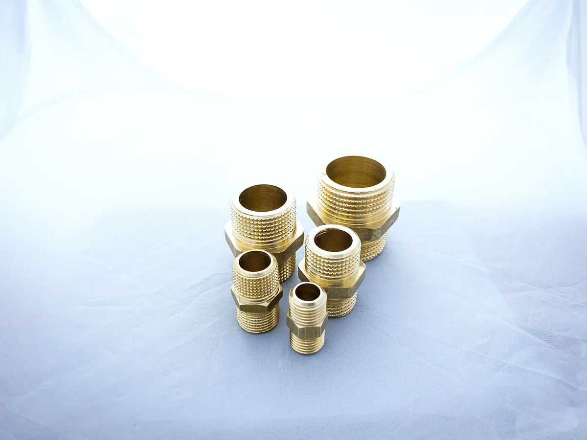 Five brass threaded adaptors in different sizes