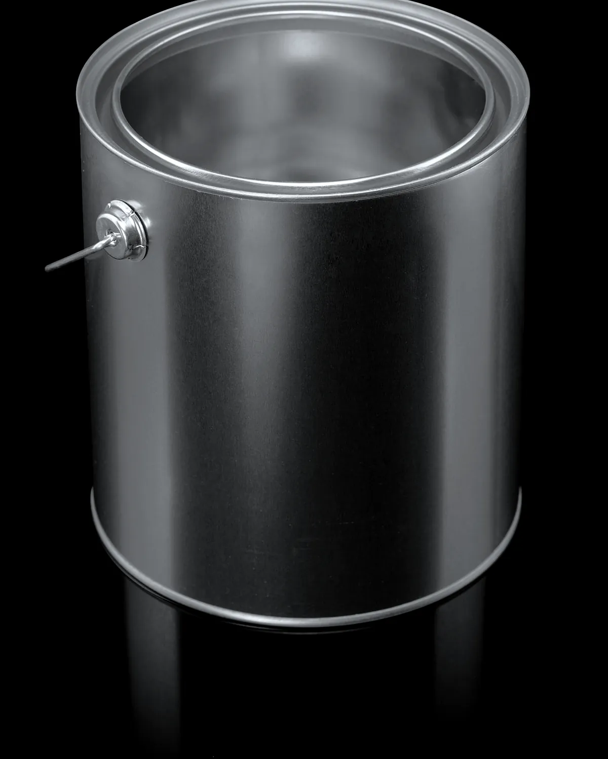 An empty steel paint tin with a wire handle