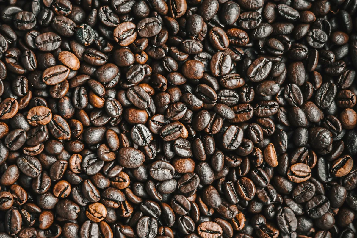 Roasted coffee beans close up, medium dark with an even colour