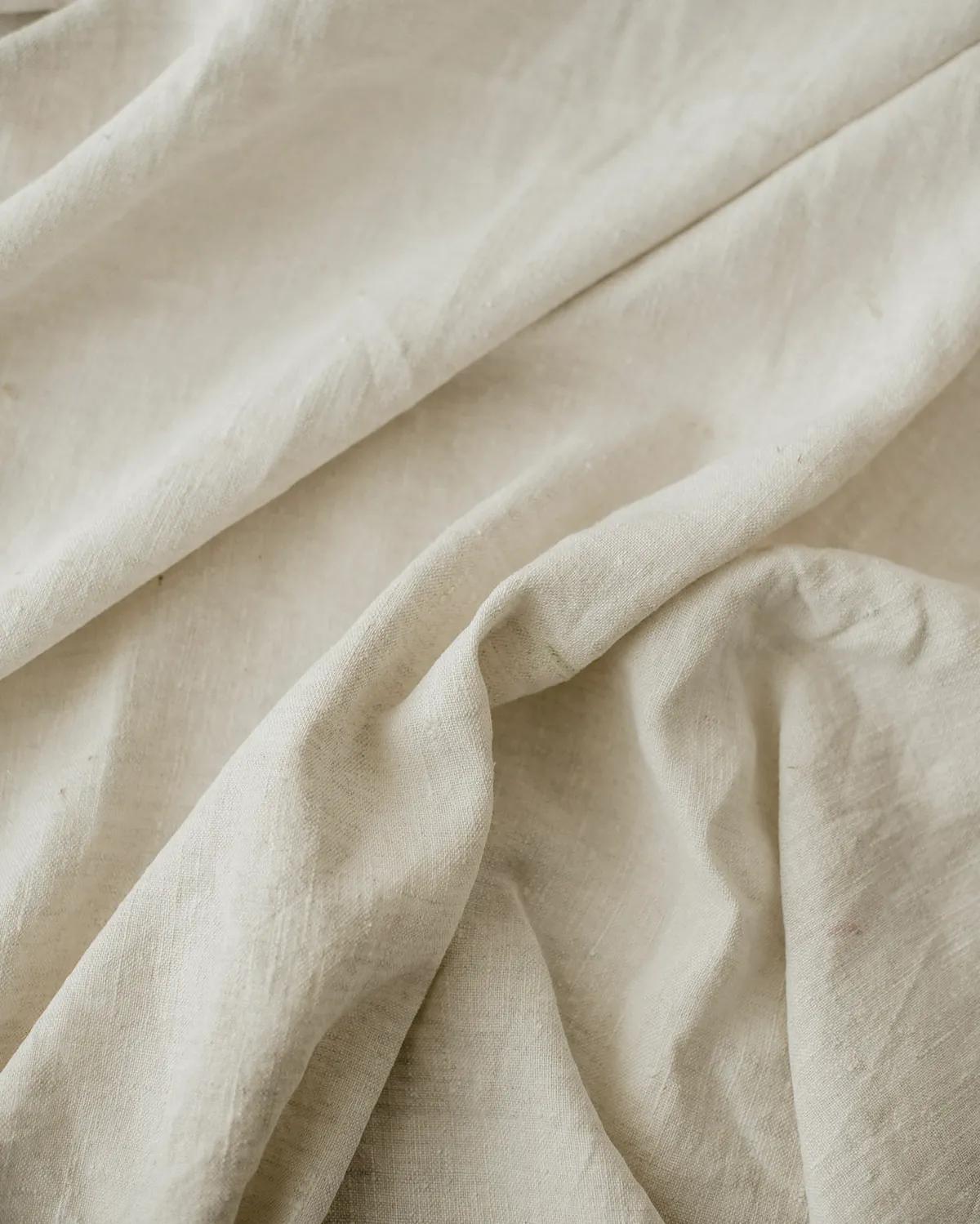 Undyed linen cloth lying in loose folds