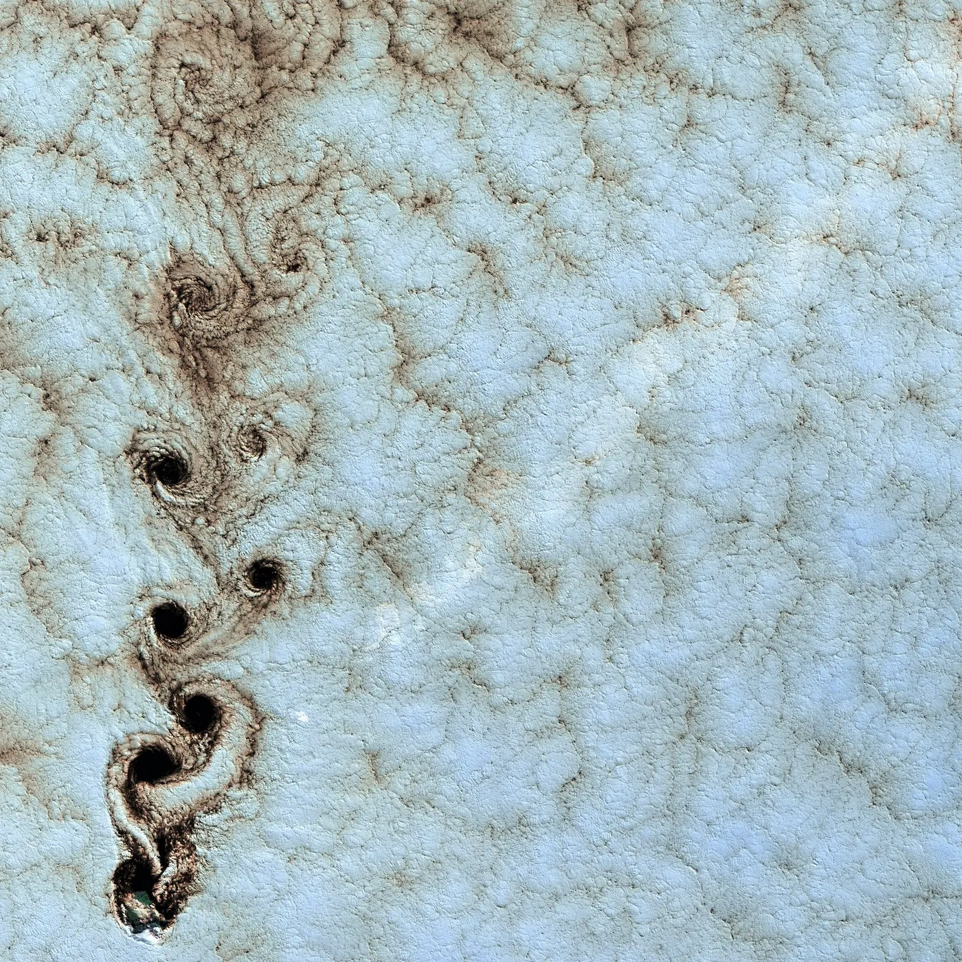 Pale blue and white crackle glaze with a trail of brown spirals