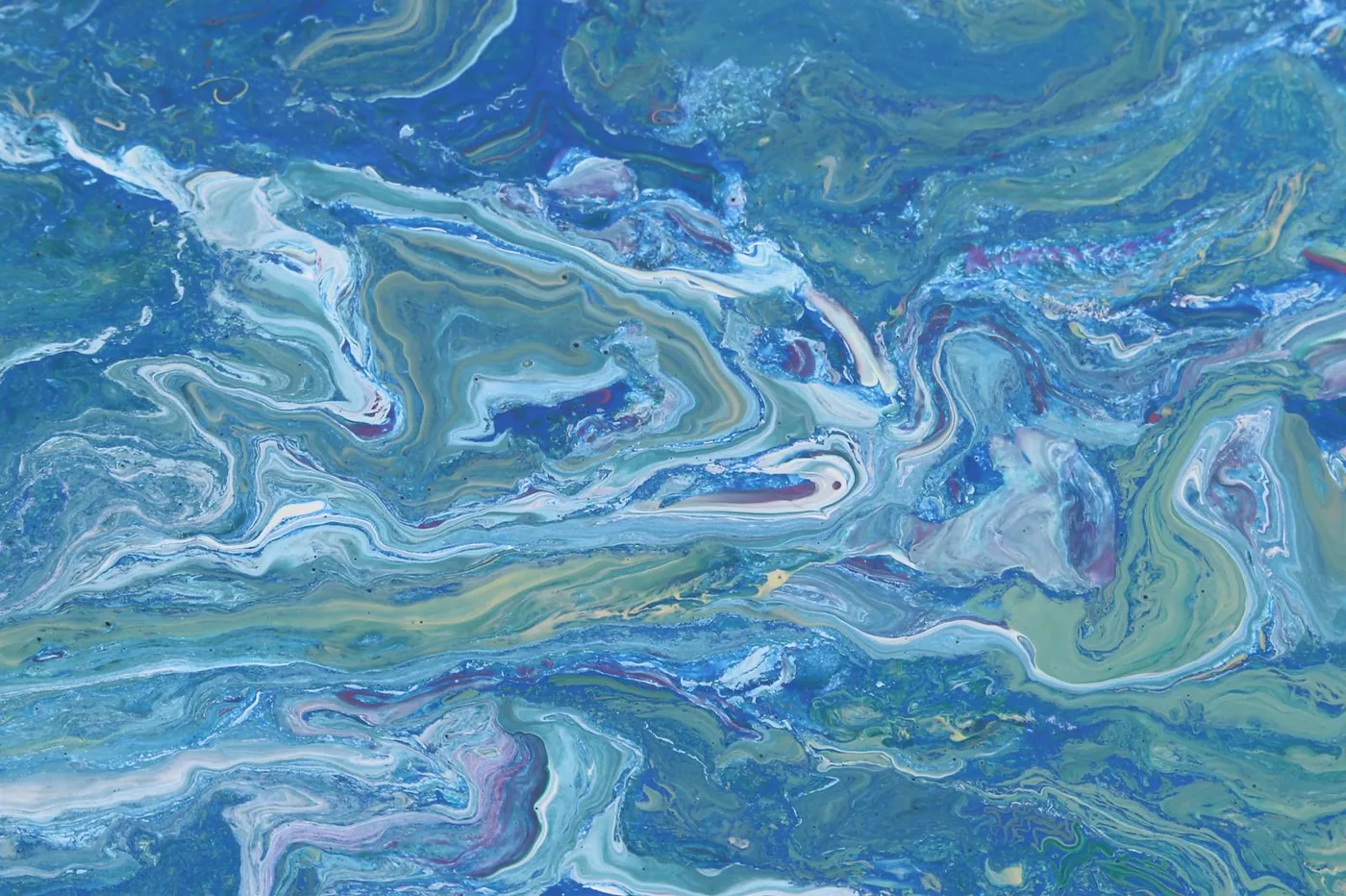 Wide poured painting with marbled bands of blue, green and white running across the panel